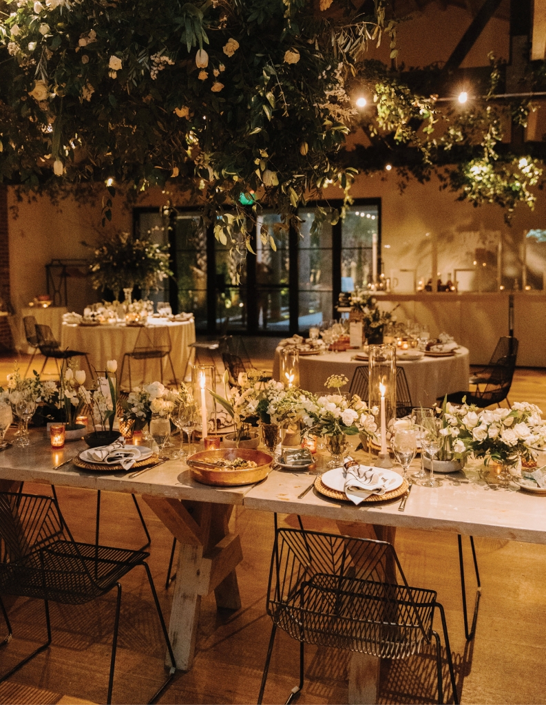 “We wanted timeless but bold, classic but a bit Old Hollywood,” explains the bride. Details like the gold chargers and art deco-style chairs helped create this feel.