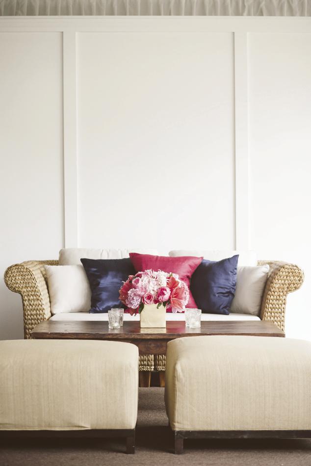 LOW-DOWN: Shannon’s inspiration board on Pinterest featured low-slung seating, so Gathering recreated that feel with benches and love seats topped with champagne-colored cushions and navy and deep pink pillows.