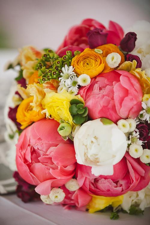 TEA TIME: For a bouquet that had &quot;garden party&quot; written all over it, Jacqueline mixed chamomile buttons, coral charm and cream peonies, yellow ranunculus, raspberry tea roses, succulents, and yellow ruffled tulips.