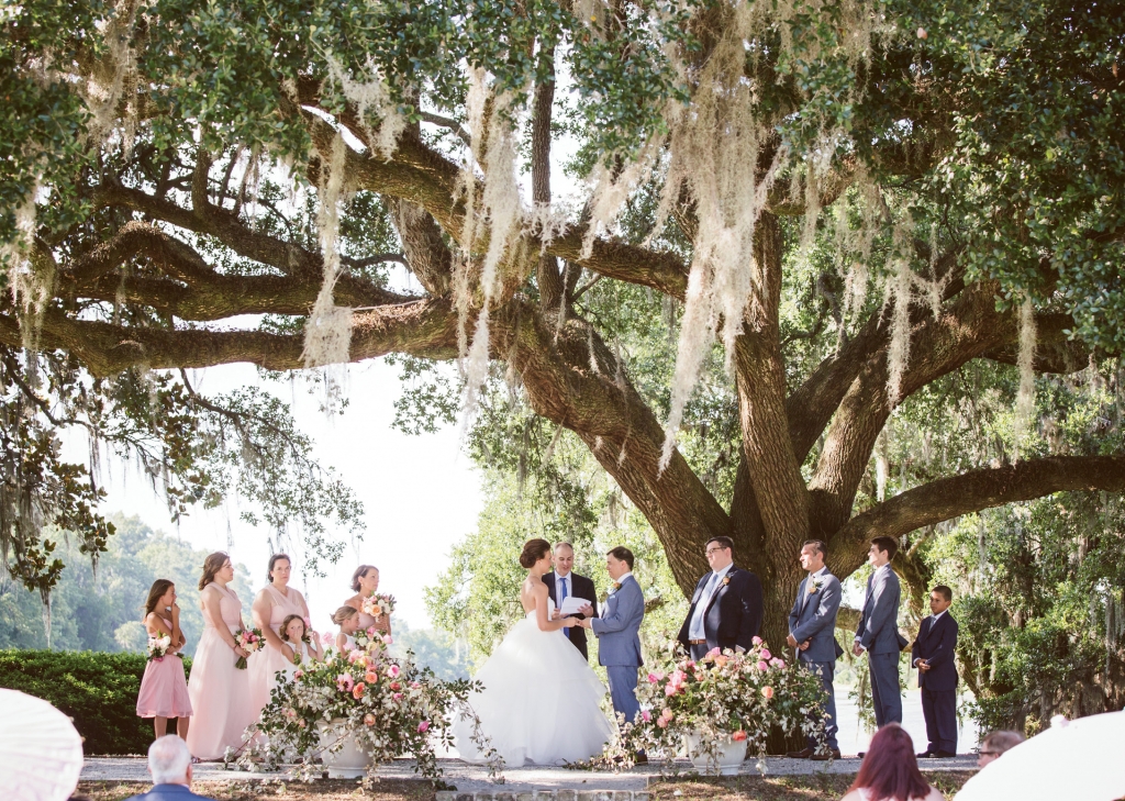 “We wanted the wedding to be both a classic taste of Charleston—the garden walk on arrival, sweet tea, hand fans, oak trees, shrimp ’n’ grits, fried green tomatoes, 10-piece big band—and a highly progressive affair with Jared’s one-time roommate serving as officiant,” says the bride.  &lt;i&gt;Amelia + Dan Photography&lt;/i&gt;