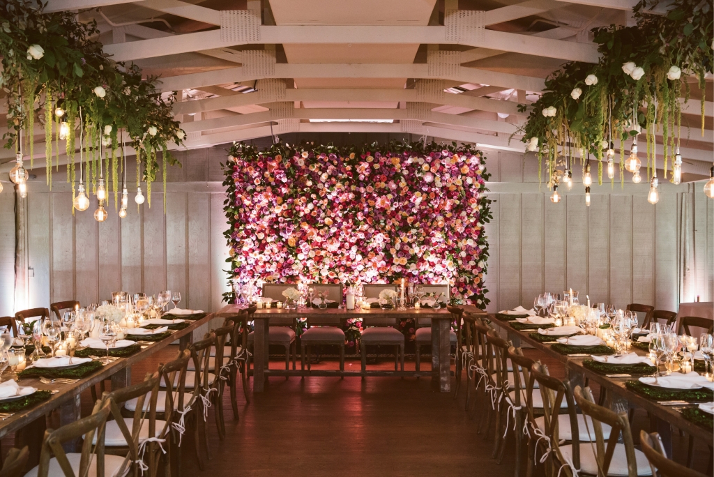 Christina worked with Petaloso to recreate Middleton’s majestic gardens inside the site’s Pavilion hall. The focal point? An eight-by-10-foot floral wall of roses and peonies that marked the head table.  &lt;i&gt;Amelia + Dan Photography&lt;/i&gt;