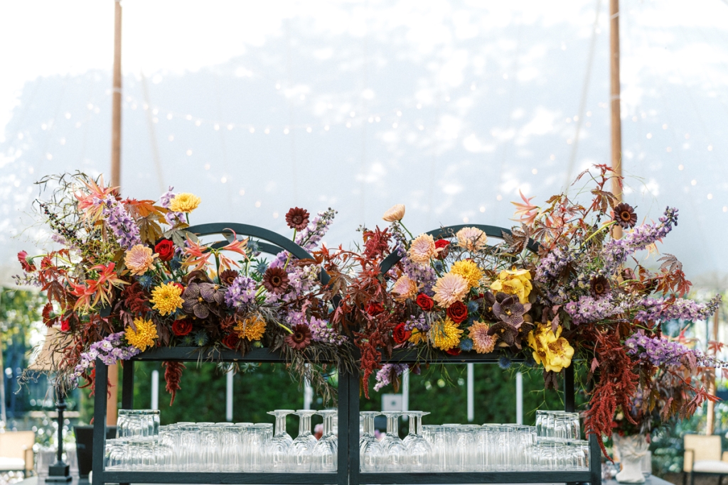 Explosions of vibrant dahlias, delphinium,  agonis, and spider lilies brought an artful elegance to the party.