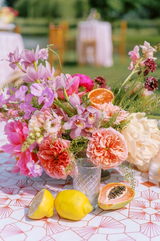 Tables were outfitted in bright patterned linens and punchy explosions of peonies, garden roses, alliums, and delphiniums. And is it even a porch party without rosé?