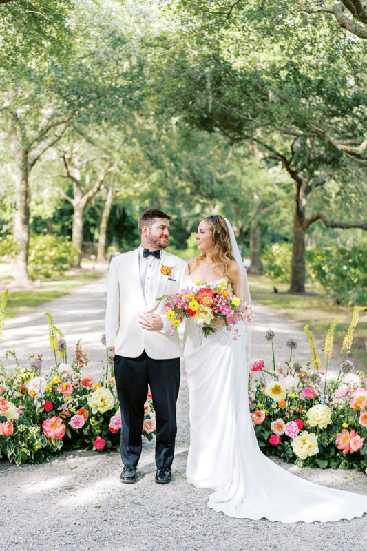 Taylor Lowman and David Cranford’s wedding featured lush blooms at every turn; David’s boutonnière was secured with an onyx brooch gifted by his bride.