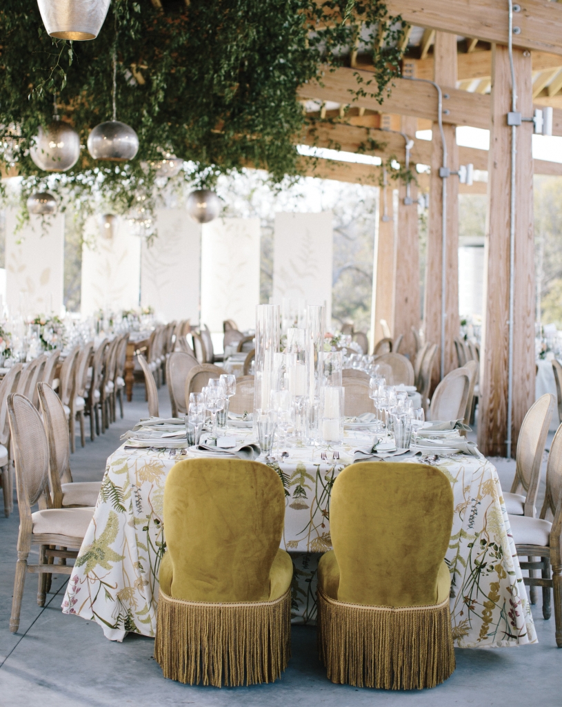 A botanical look was influenced by The Bend’s conservation-driven mission, and was played up in the hand-painted seating chart and stage backdrop and in the custom table linens, napkins, and butler service towels, which were sourced and produced by Ooh! Events.