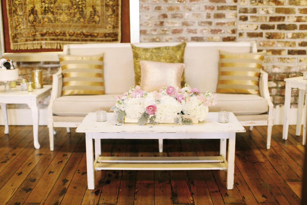 Mix and match rental pieces with your own finds. Cory created lounges from EventHaus’ “Provence” furniture, then upped the sparkle factor with gold-kissed pillows she sourced online.