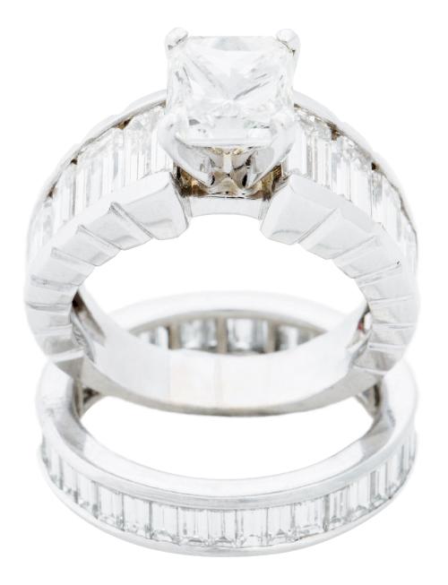 18K white gold ring with 2.01 ct. diamond and accent diamonds (3.9 total cts.) and 18K white gold band with diamonds (1.85 total cts.),  both from Nice Ice  Fine Jewelry; $37,440 and $8,360, respectively