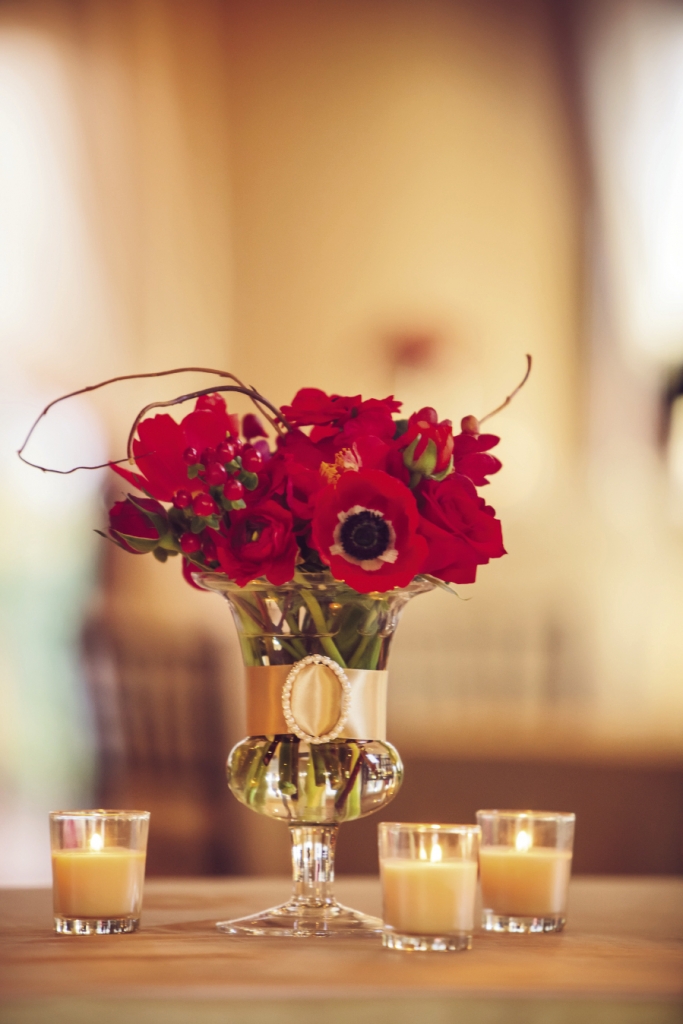 PRETTY AS A POPPY: Judy Johnston, exclusive floral designer for Engaging Events, dotted the reception with vivid red poppies accented with golden ribbon.