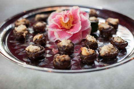 FRESH IDEA: Mosaic Catering dressed trays of stuffed mushrooms with fresh camellias that were picked from the grounds.