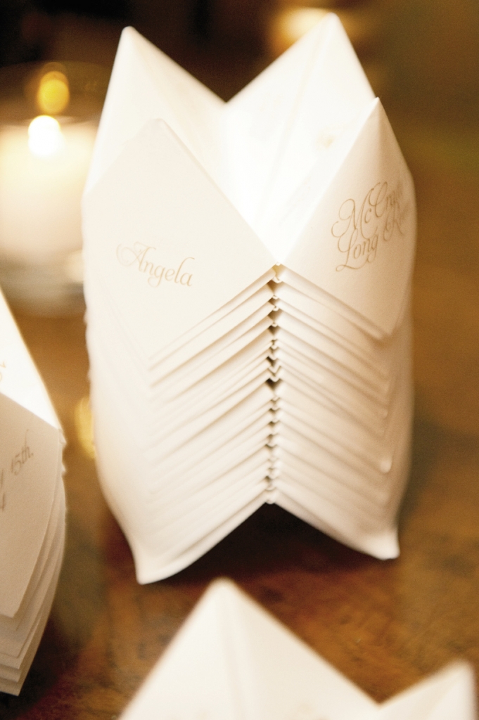 Angela and David folded gold-embossed programs by Dodeline Design into old-school paper fortune tellers.