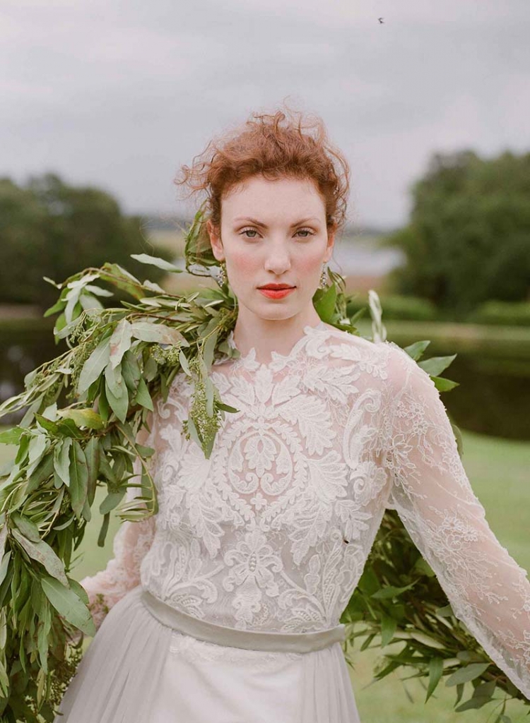 Emily Kotarski’s “Buckingham” silk gown with illusion lace top, faille skirt, and detachable chiffon train from Emily Kotarski Bridal. Sapphire and diamond earrings from Croghan’s Jewel Box. Seeded eucalyptus garland from Out of the Garden.  &lt;i&gt;Photograph by Corbin Gurkin&lt;/i&gt;