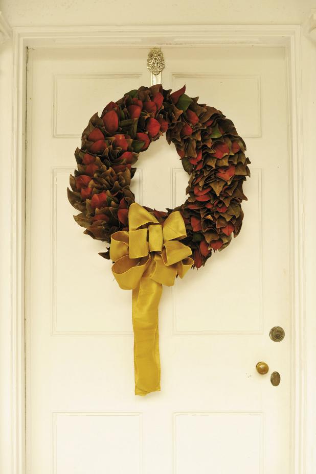 &#039;TIS THE SEASON: The green and rust of wreaths from The Magnolia Company were accented with golden bows for continuity.