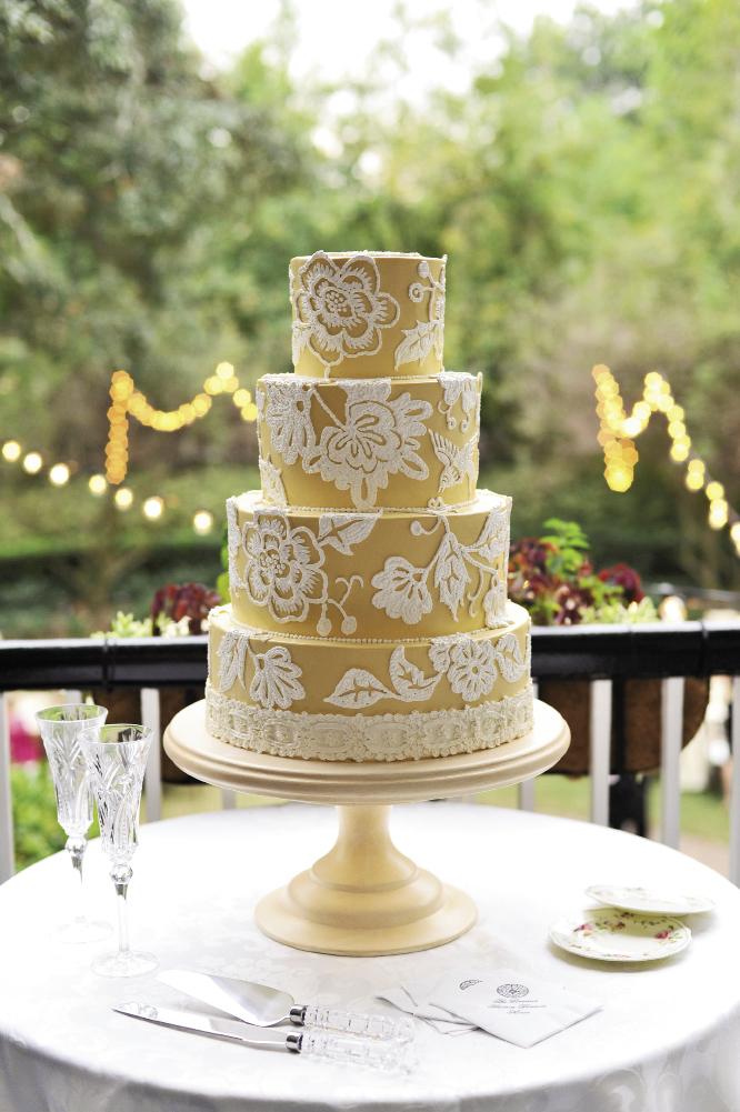 PATTERN PARADE: Jim Smeal’s gold-and-white masterpiece borrowed patterns from the linens, Allison’s sash, and the home’s staircase. Vintage china from Charleston Starfish was a colorful surprise from the bride’s mother.