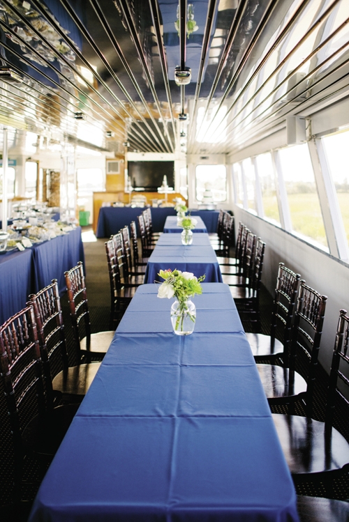 GALLEY KITCHEN: Open seating and food stations, like those Hamby Catering set up for Jamie and Tyler, work well for cruise receptions, as guests can munch, mingle, and sightsee as they wish, says Camille. Keep décor simple, she adds, so the scenery takes center stage.