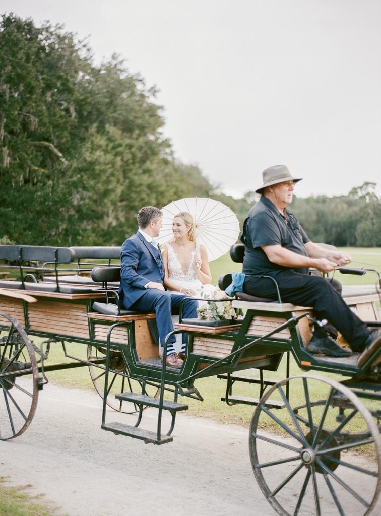 The couple explored the grounds by wagon after the ceremony; given the bride baked nearly 100 loaves of banana bread (from her mother’s “cherished” recipe) for welcome bags, she’d earned a little downtime.