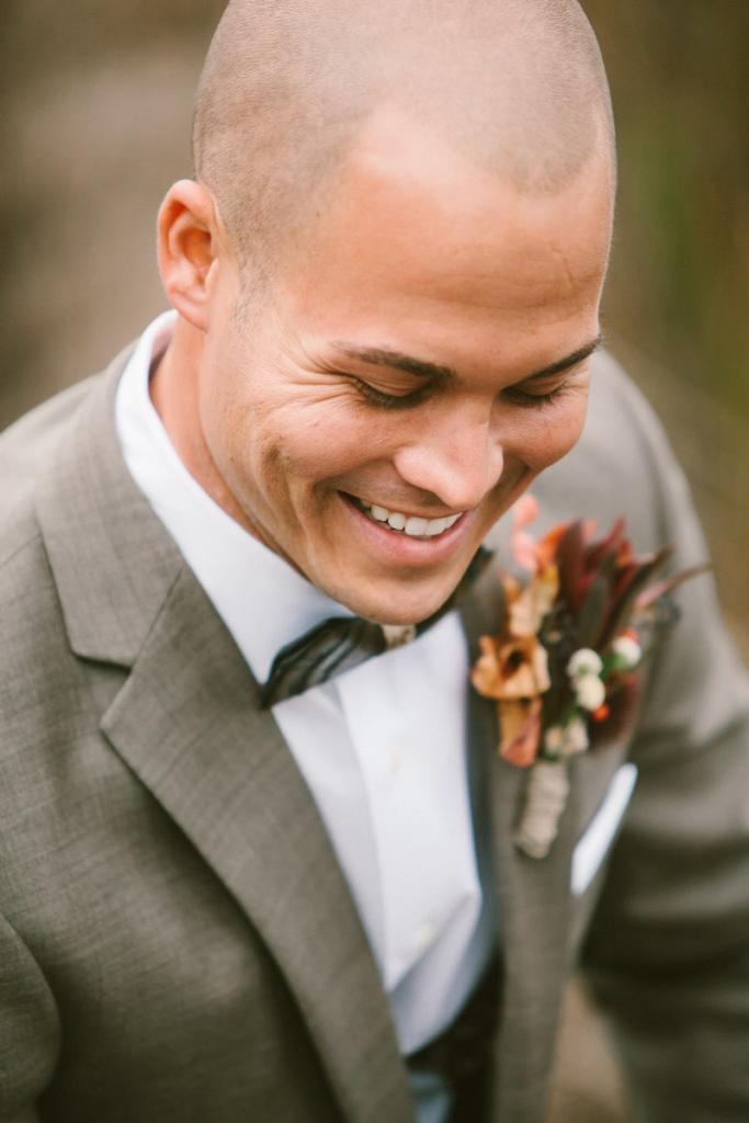 Groom&#039;s suit from Jos. A. Bank. Bow tie by Brackish. Boutonnière and photograph by Mark Williams Studio.