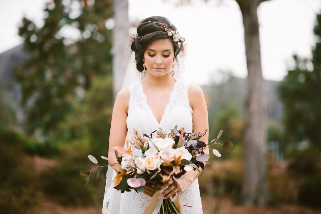 Bride&#039;s gown by Watters from Jean&#039;s Bridal. Veil from Bridal House of Charleston. Hair by Studio 285 and MW Salon. Makeup by Dannon K. Collard and BeautiControl. Hair accessory, bouquet, and photograph by Mark Williams Studio.