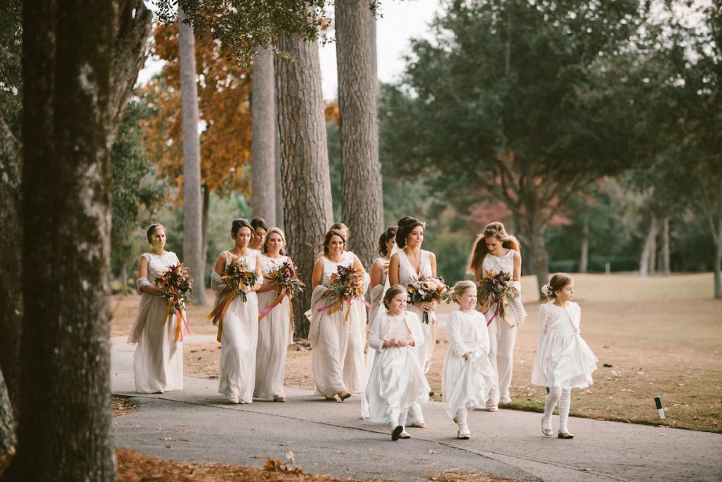 Bridesmaids&#039; dresses by Lela Rose (available locally through Bella Bridesmaids). Flower girls&#039; dresses from Zulily and tights and shoes from Gap. Florals and photograph by Mark Williams Studio at the Daniel Island Club.