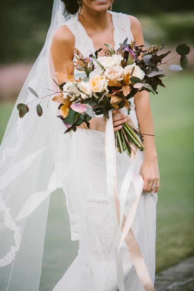 Bride&#039;s gown by Watters from Jean&#039;s Bridal. Veil from Bridal House of Charleston. Bouquet and photograph by Mark Williams Studio at the Daniel Island Club.