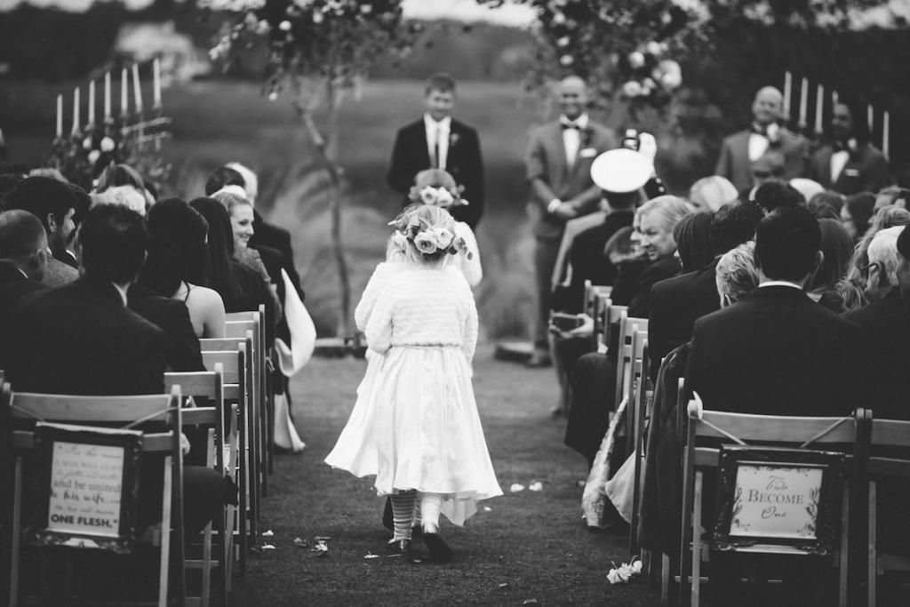 Flower girls&#039; dresses from Zulily and tights and shoes from Gap. Florals and photograph by Mark Williams Studio at the Daniel Island Club.