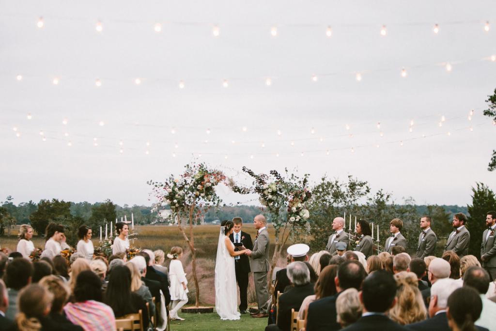 Bistro lights from Charleston Uplighting. Wedding design and photograph by Mark Williams Studio at the Daniel Island Club.