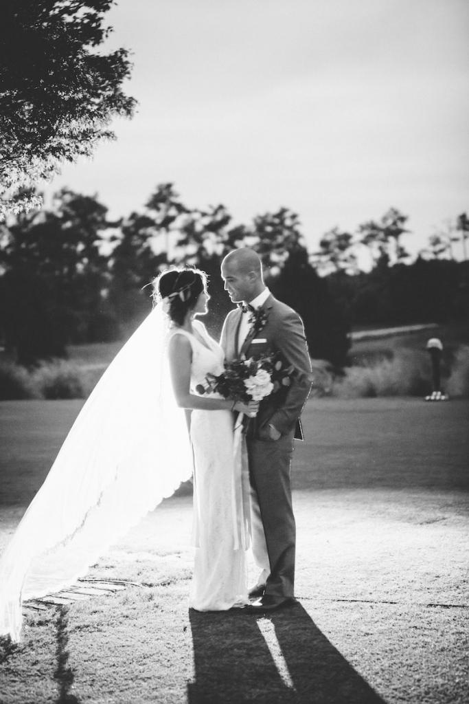 Bride&#039;s gown by Watters from Jean&#039;s Bridal. Veil from Bridal House of Charleston. Groom&#039;s suit from Jos. A. Bank. Bow tie by Brackish. Photograph by Mark Williams Studio.