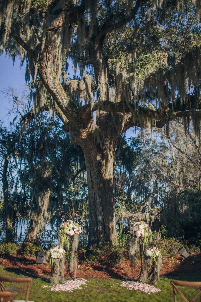 Ceremony florals by Tiger Lily Weddings. Wedding design by Engaging Events. Image by Richard Bell Weddings at Magnolia Plantation &amp; Gardens.