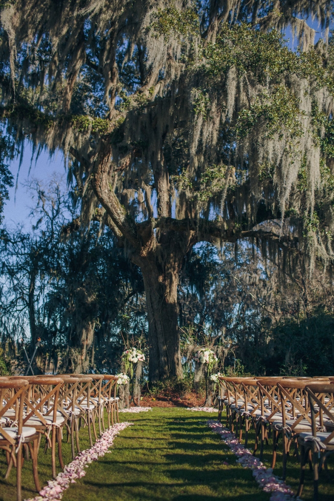 Ceremony florals by Tiger Lily Weddings. Wedding design by Engaging Events. Rentals by Snyder Events and EventWorks. Image by Richard Bell Weddings at Magnolia Plantation &amp; Gardens.