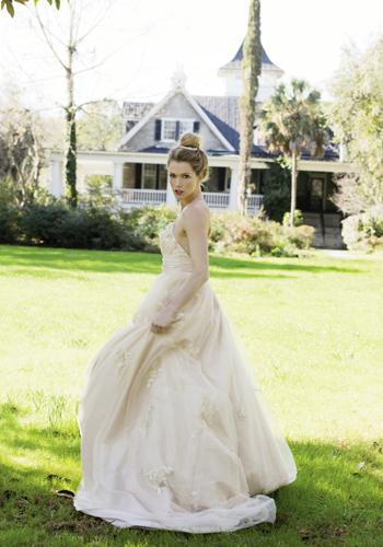 Wtoo’s “Oriana” tulle and taffeta gown in champagne with Swarovski crystals and lace appliqué bodice available through Jean’s Bridal and Gown Boutique of Charleston. Pearl and rhinestone hair comb from Jean’s Bridal. (opposite page) Cross That Bridge: LulaKate’s “O’Hara” gown in ivory with French  lattice lace and  floral detail.