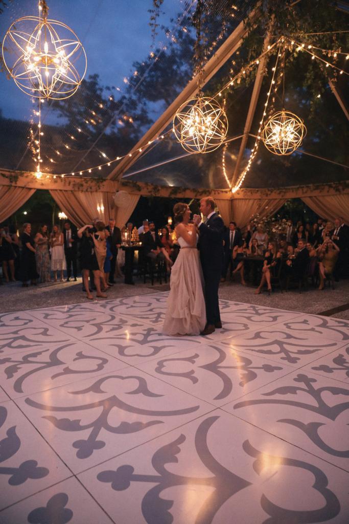 The newlyweds (and later the guests) spun each other on a dance floor patterned with appliqués from Charleston Wraps.