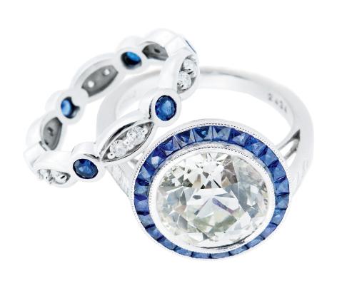 Platinum ring with 4.87  ct. diamond and sapphires  (.3 total cts.) from Joint  Venture Estate Jewelers; $37,500. 14K white gold  band with sapphires and diamonds (.62 total cts.) from Skatell’s Manufacturing  Jewelers; $1,650