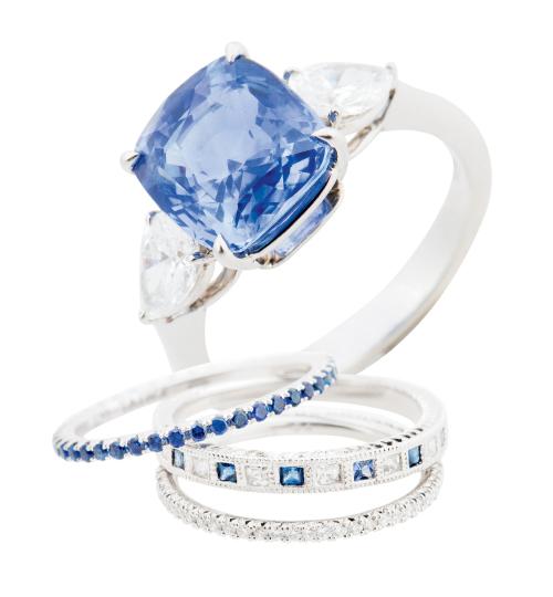 18K platinum ring  with 5.12 ct. sapphire and  diamonds from Croghan’s Jewel Box; $22,425. 18K white gold band with sapphires and diamonds (price on request), platinum band with  diamonds ($2,145), and Kwiat’s 18K white gold band with sapphires ($875), each from Paulo Geiss Jewelers