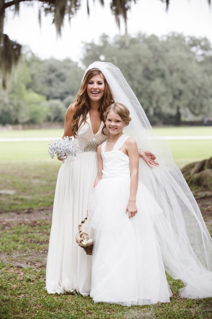 Bride’s gown by Jenny Packham from White on Daniel Island. Flower girl’s dress from Etsy. Beauty by Wedding Hair by Charlotte. Image by amelia + dan photography at Middleton Place.