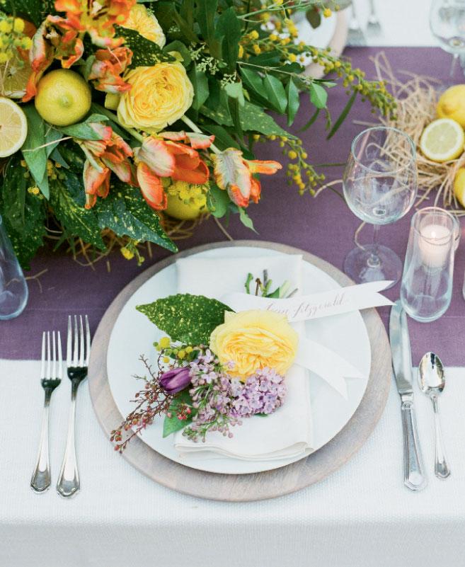 Make a mini masterpiece when you pair calligraphed paper banners with nosegays for placecards and guest favors both. Florals and styling by Mindy Rice Floral &amp; Event Design. Tabletop rentals from Ooh! Events. Photograph by Corbin Gurkin.