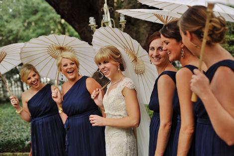 LOVELY LADIES: Parasols carried by the bride and her maids added old-school charm to the wedding party&#039;s photo ops..