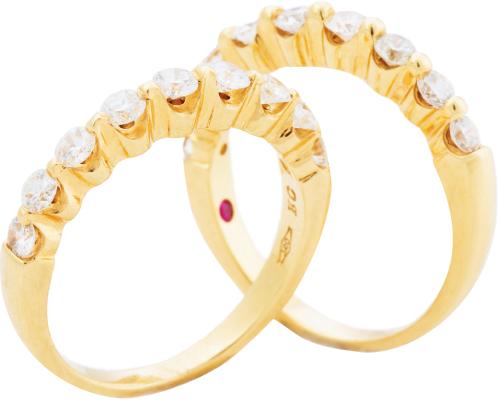 Two 18K yellow gold bands with diamonds (.60 total cts. each) from Roberto Coin; $2,740 each